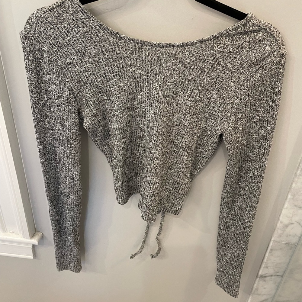 Garage top. Gray brand new w tags. Lace up back. Perfect for a teenager.